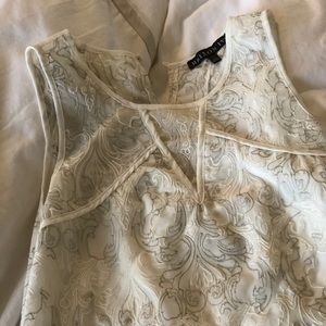 Delicate white tank top with metallic detailing